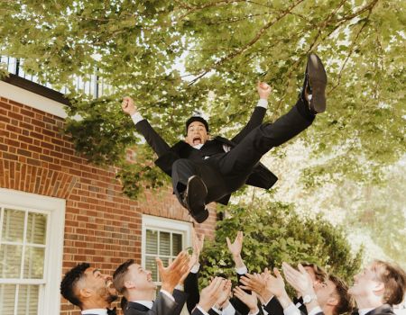 Groomsmen Throwing Groom